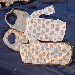 Matching onesie with bibs and burping cloths